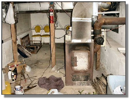 Tennessee Real Estate - Farmette Property - 1582 - basement with wood furnace
